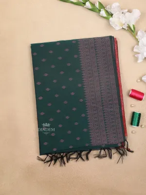 Dark Green Silk Cotton Saree with Leaf Motifs Design on the Body with Designed Border